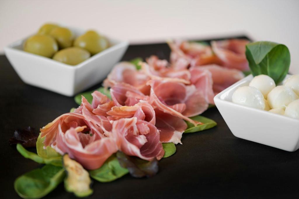 a close up of some food on a table at AC Hotel Venezia by Marriott in Venice