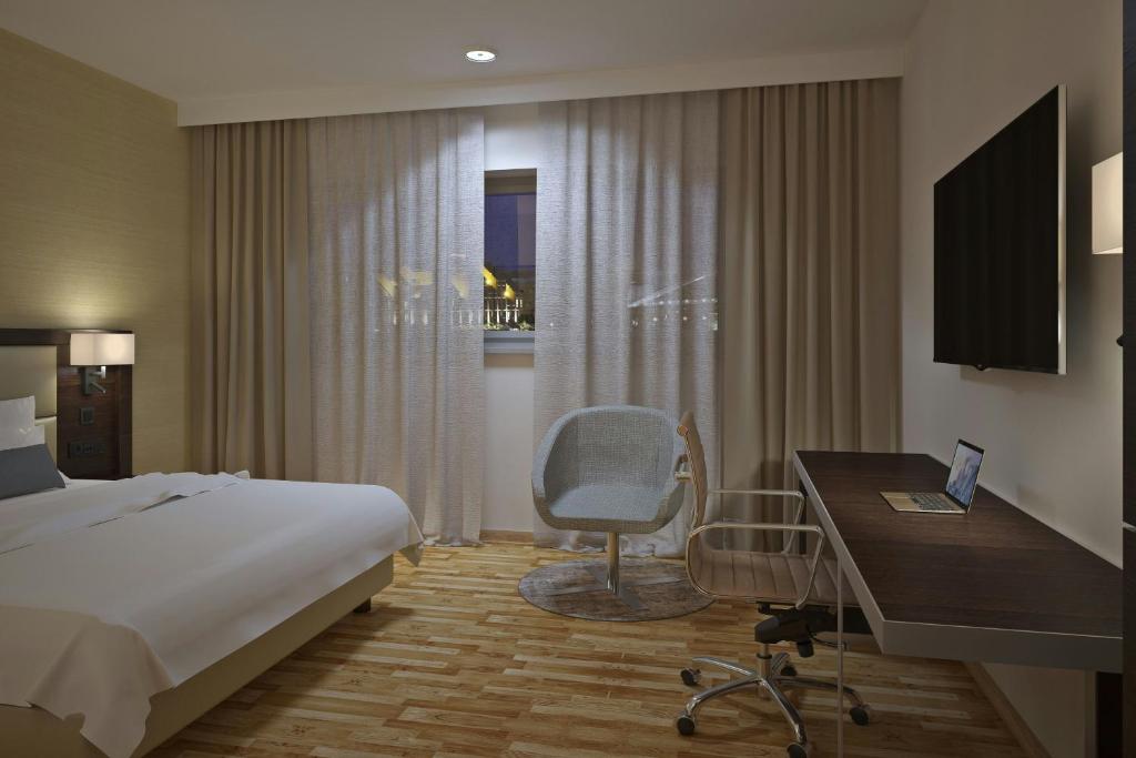 TV a/nebo společenská místnost v ubytování AC Hotel by Marriott Milan Sesto