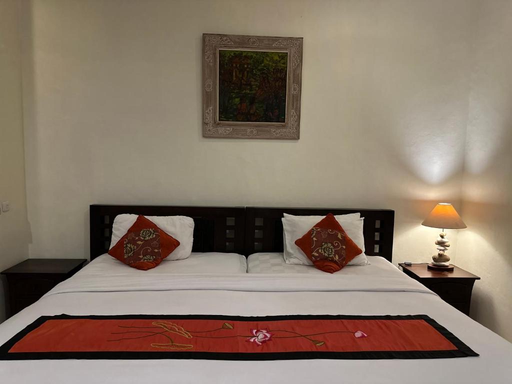 Postel nebo postele na pokoji v ubytování Brata Inn Ubud