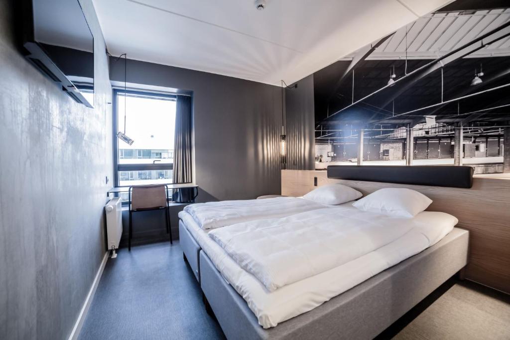 Uma cama ou camas num quarto em Four Points Flex by Sheraton Aalborg