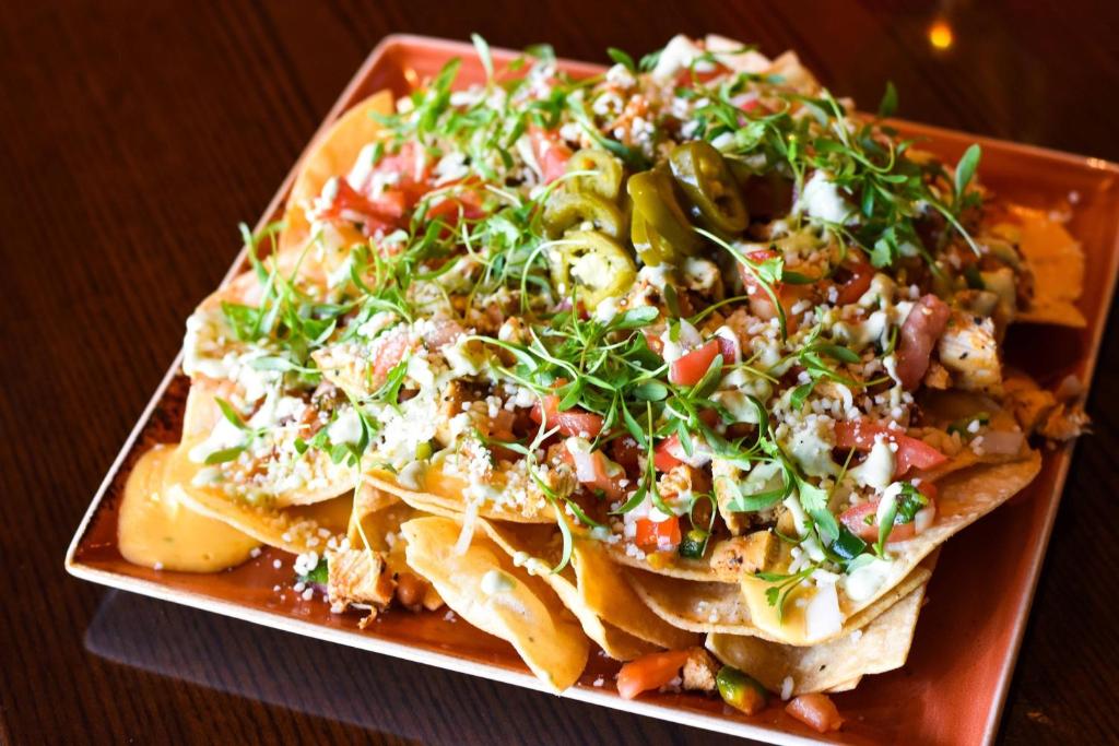 a plate of nachos with a salad on it at Houston Airport Marriott at George Bush Intercontinental in Houston