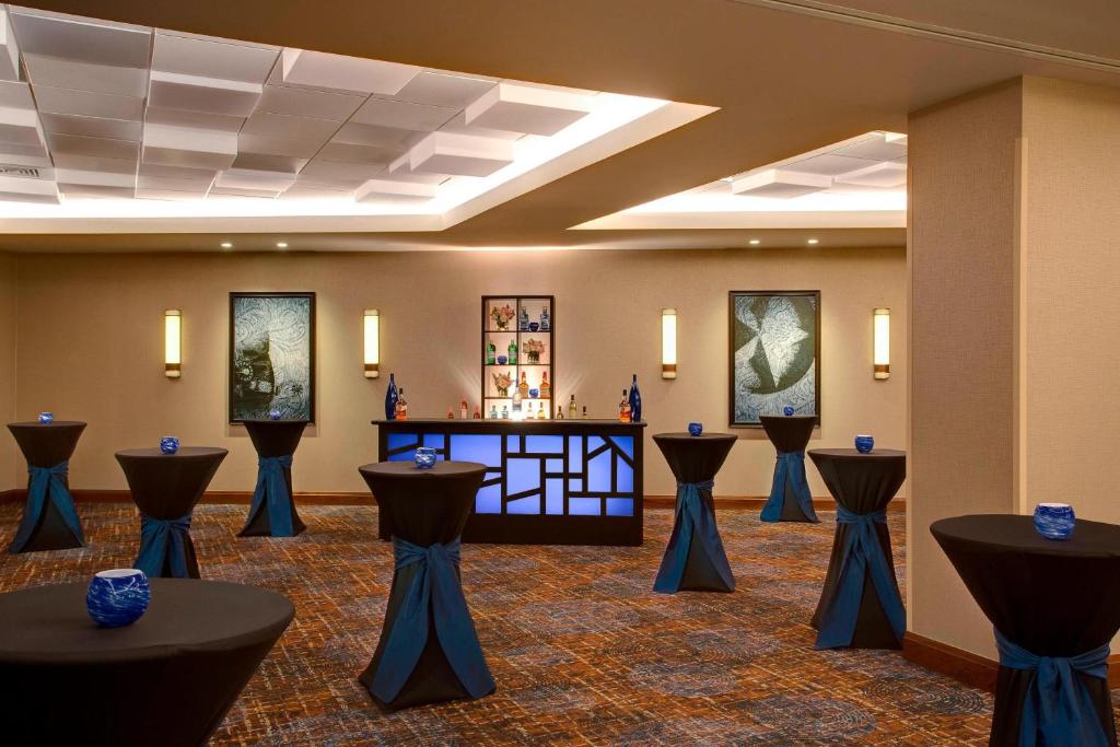 a conference room with blue vases on the tables at Houston Airport Marriott at George Bush Intercontinental in Houston