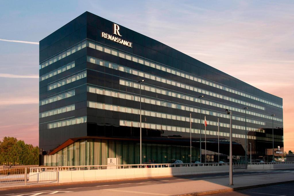 a black building with a russianribune sign on it at Renaissance Warsaw Airport Hotel in Warsaw