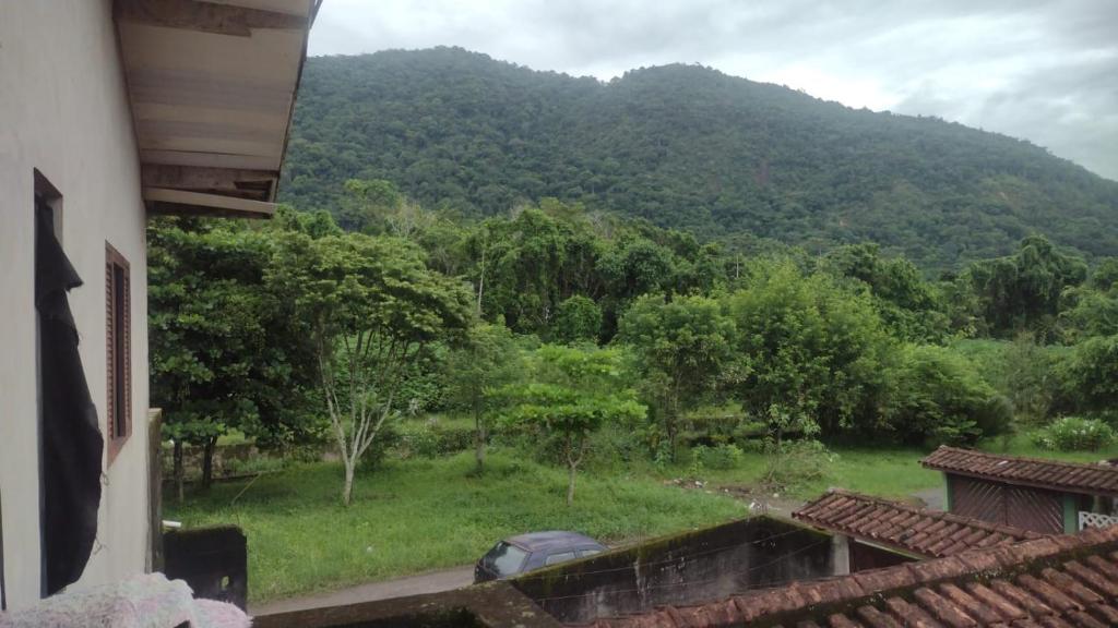 a view of a mountain from a house at Casa Branca Sobrado in Caraguatatuba