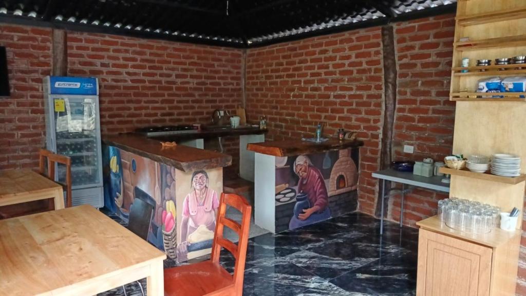 Kuchyň nebo kuchyňský kout v ubytování Cabañas El Guayabillo - Baños de agua Santa