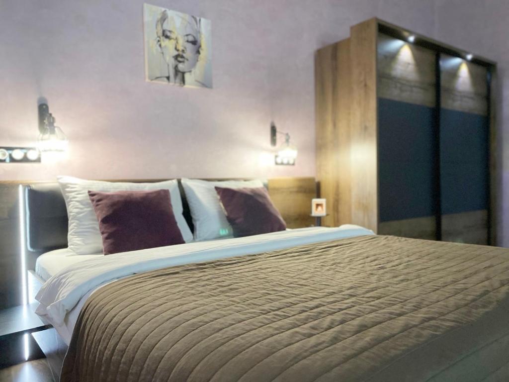 En eller flere senge i et værelse på Apartment ЖД вокзал, Центр