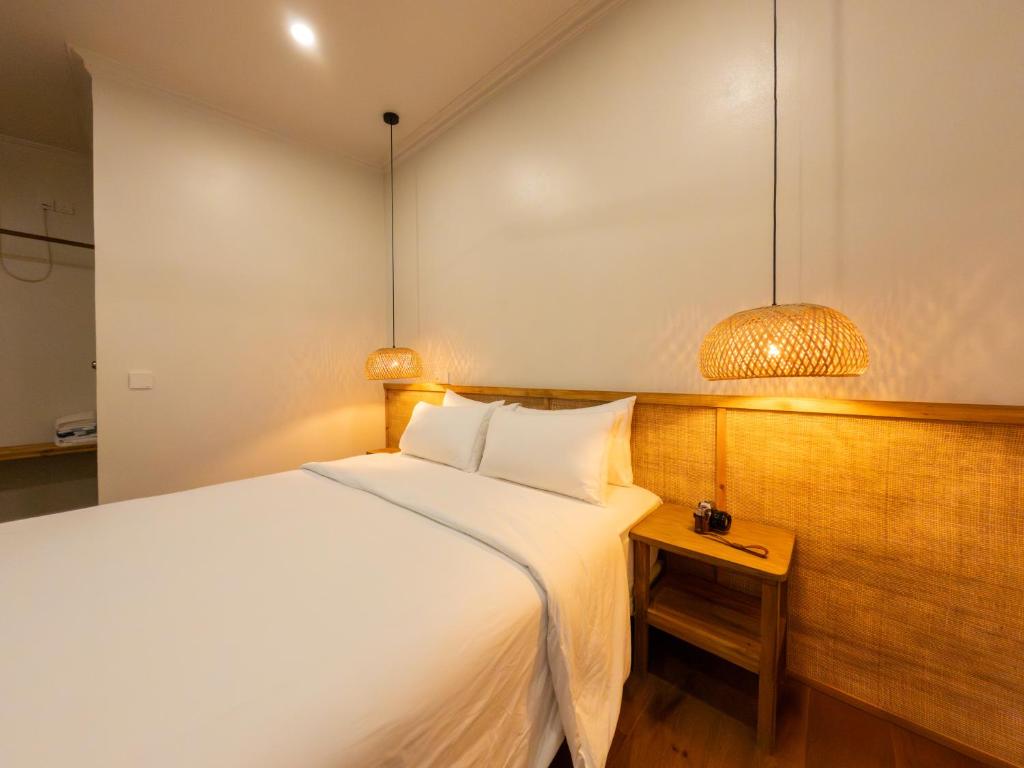 Postel nebo postele na pokoji v ubytování Noorani Retreat Dhiffushi