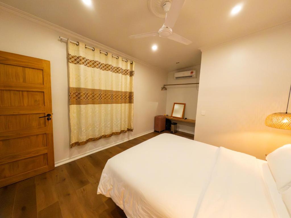 Postel nebo postele na pokoji v ubytování Noorani Retreat Dhiffushi