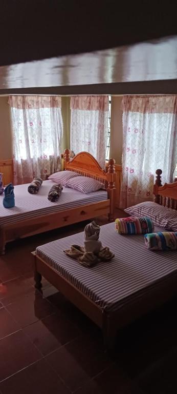 Ένα ή περισσότερα κρεβάτια σε δωμάτιο στο Norman's House