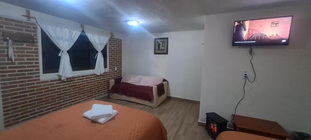 Postel nebo postele na pokoji v ubytování Cabaña La Hacienda 1