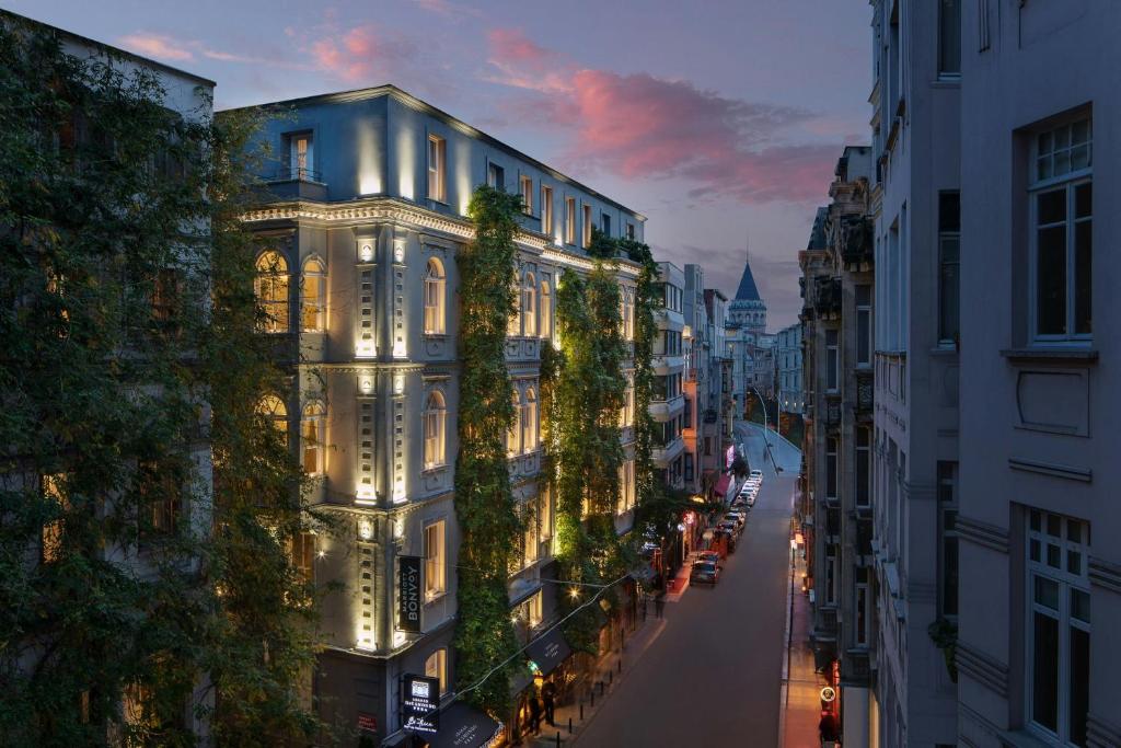 a view of a street at night with buildings at Adahan DeCamondo Pera, Autograph Collection in Istanbul