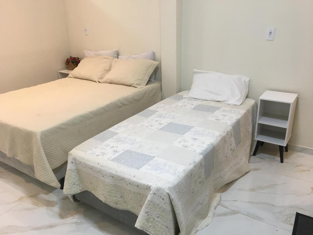 Katil atau katil-katil dalam bilik di Flat com quarto e sala