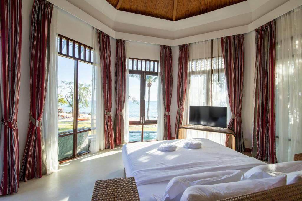 Postel nebo postele na pokoji v ubytování Ajinta Resort