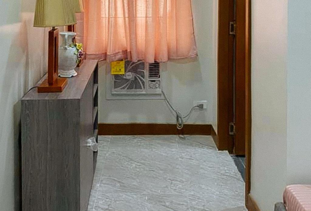 Postel nebo postele na pokoji v ubytování Leonila's Travellers Inn