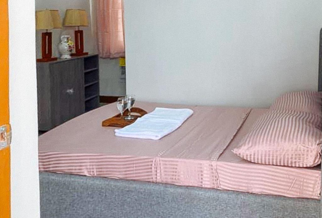 Postel nebo postele na pokoji v ubytování Leonila's Travellers Inn
