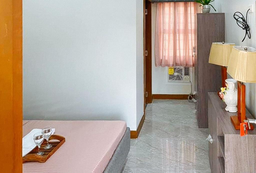 Postel nebo postele na pokoji v ubytování Leonila's Travellers Inn