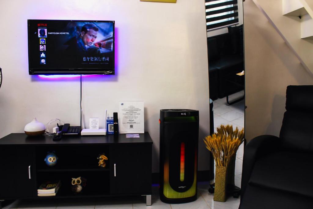 TV o dispositivi per l'intrattenimento presso Caryolba hometel - Calapan