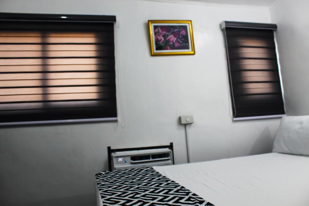 Letto o letti in una camera di Caryolba hometel - Calapan
