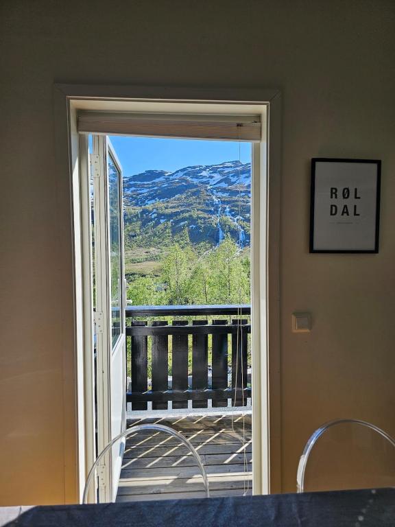 a door to a balcony with a view of a mountain at Mountain view 1 in Håra