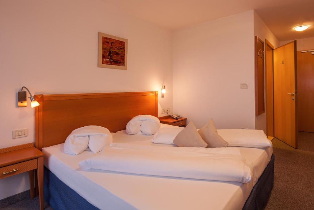 Postel nebo postele na pokoji v ubytování Hotel Tannerhof