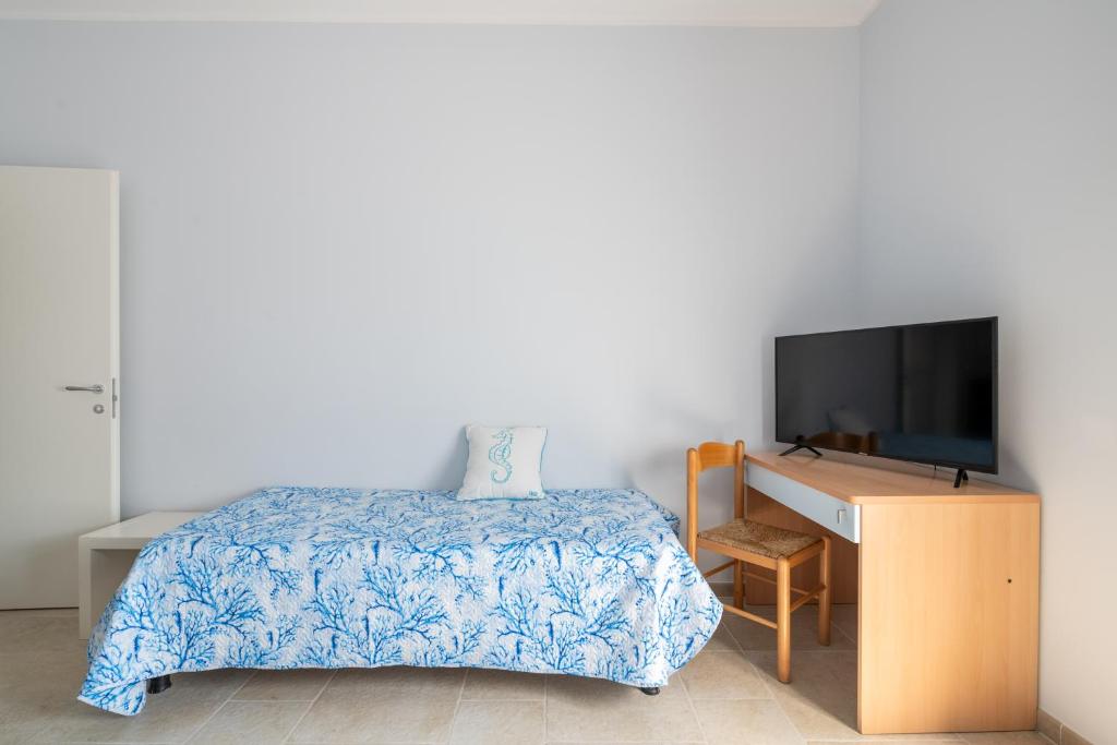 TV a/nebo společenská místnost v ubytování Riva Vieste Suites