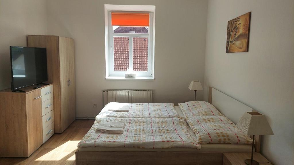 Postel nebo postele na pokoji v ubytování Hotýlek.eu