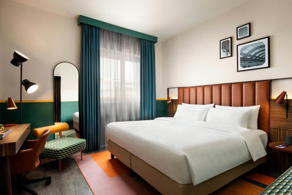 Postel nebo postele na pokoji v ubytování Duo Milan Porta Nuova, a Tribute Portfolio Hotel