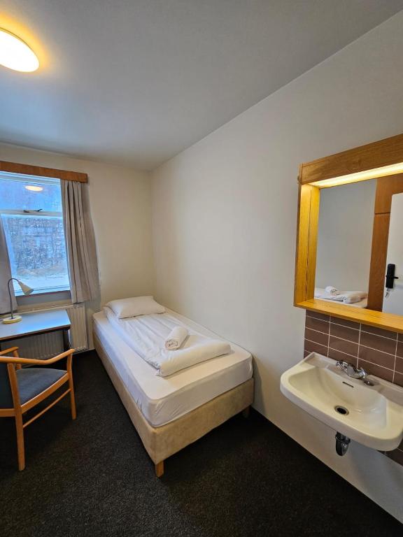 Postel nebo postele na pokoji v ubytování Skogar Hostel