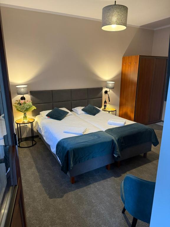 Postel nebo postele na pokoji v ubytování GórSKI SPA Karpacz I dawniej APOLLO