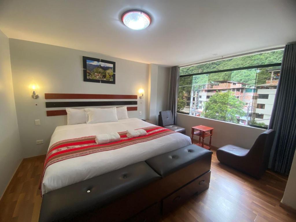 Postel nebo postele na pokoji v ubytování Raymi Inn MachuPicchu