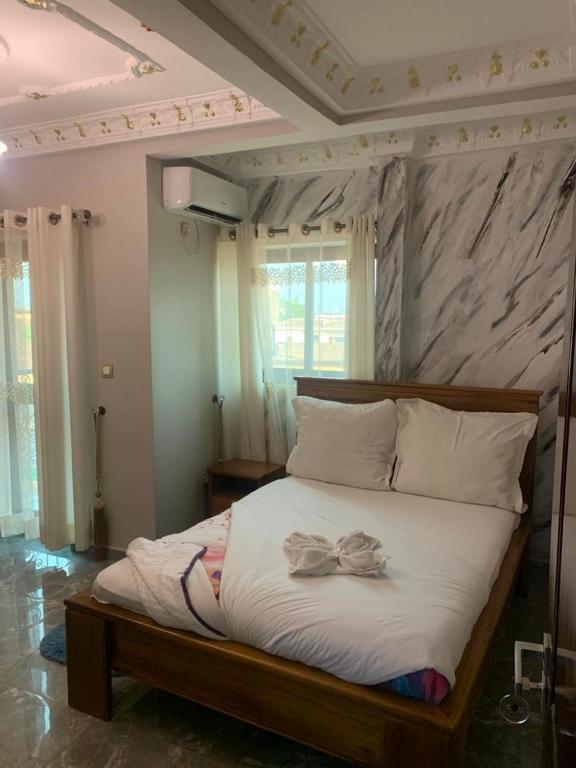 Postel nebo postele na pokoji v ubytování DEUDJUI HOTEL