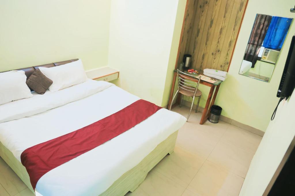 Postel nebo postele na pokoji v ubytování Hotel Shaurya