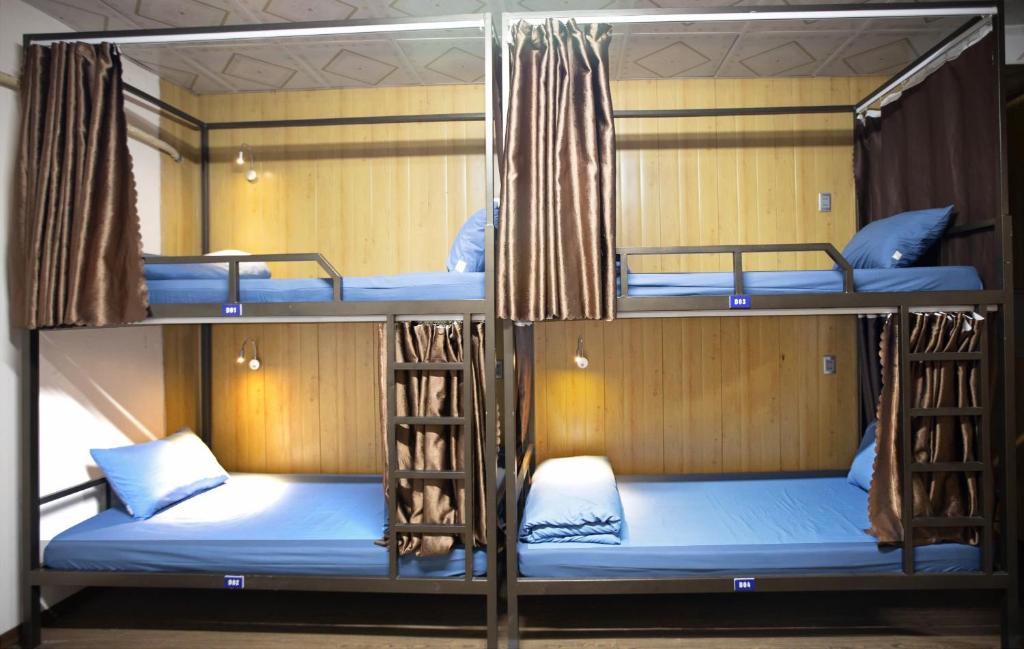 Postel nebo postele na pokoji v ubytování Moc May by Northstar Hostel & Tours