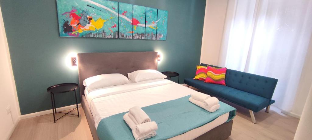 a small bedroom with a bed and a couch at San Peter Vatican City quiet and lovely apartment in Rome