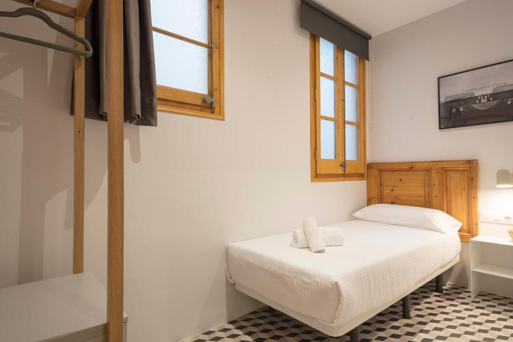 Postel nebo postele na pokoji v ubytování Central Apartments Barcelona