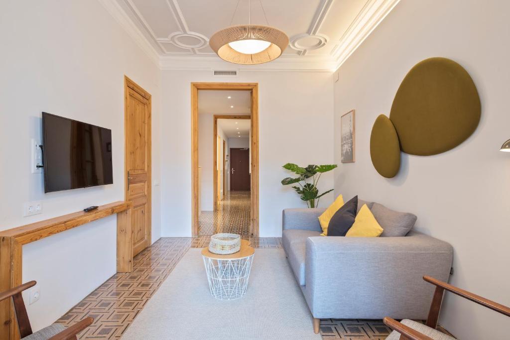 TV a/nebo společenská místnost v ubytování Central Apartments Barcelona
