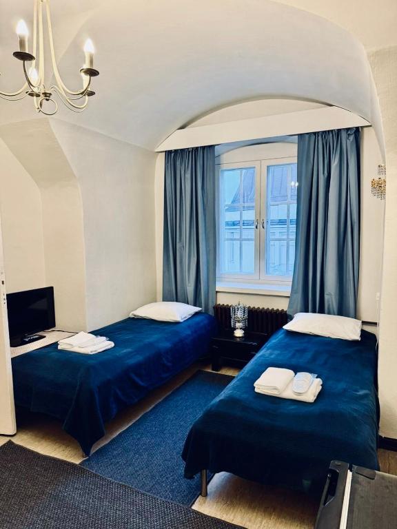 Postel nebo postele na pokoji v ubytování Senate Hotel