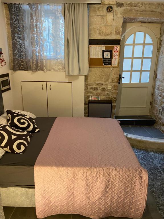 Posteľ alebo postele v izbe v ubytovaní Dragazzo studio