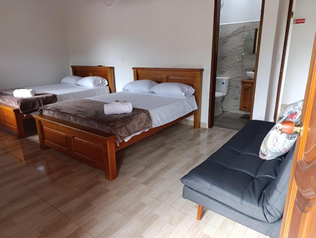 Postel nebo postele na pokoji v ubytování Hotel Macao