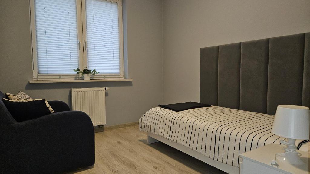 Posteľ alebo postele v izbe v ubytovaní Jedenastka