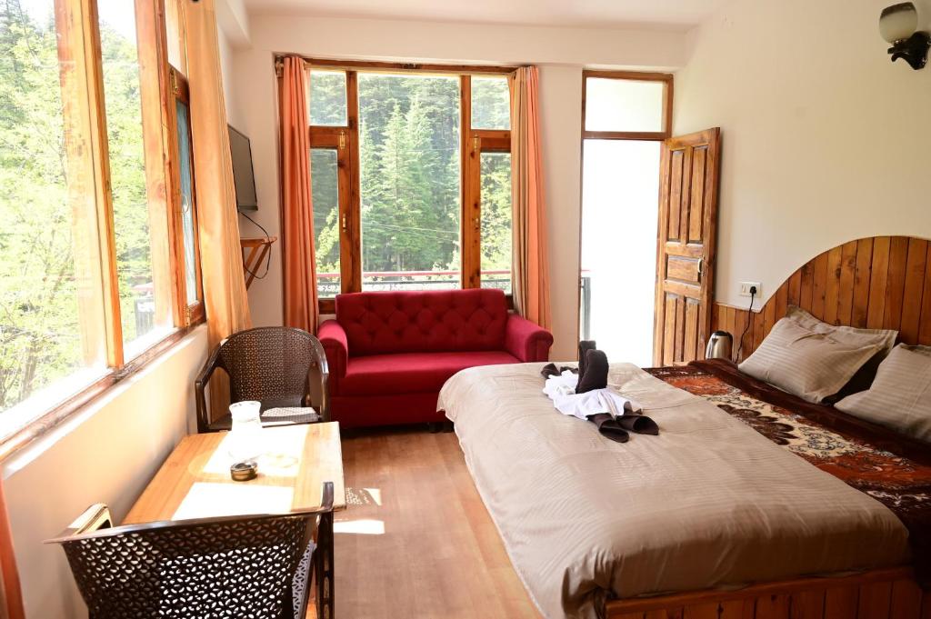 Postel nebo postele na pokoji v ubytování Rest N Ramble - Manali