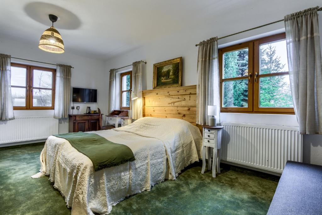 Postel nebo postele na pokoji v ubytování Siedlisko Nawiady - hotel butikowy