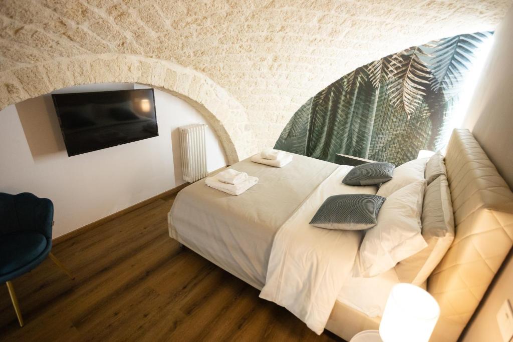 Postel nebo postele na pokoji v ubytování Stelladimare Suites