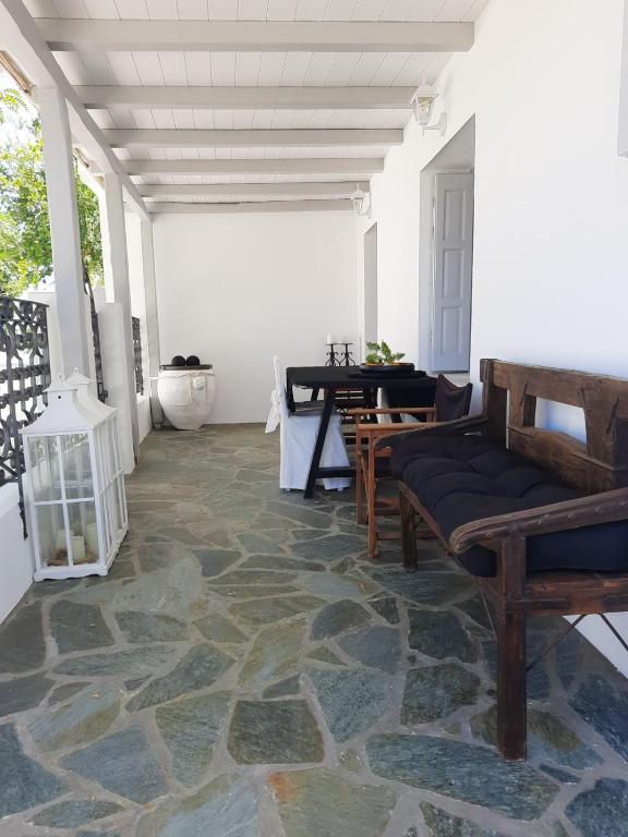 a living room with a couch and a table at Central Skyros Hideaway in Skiros