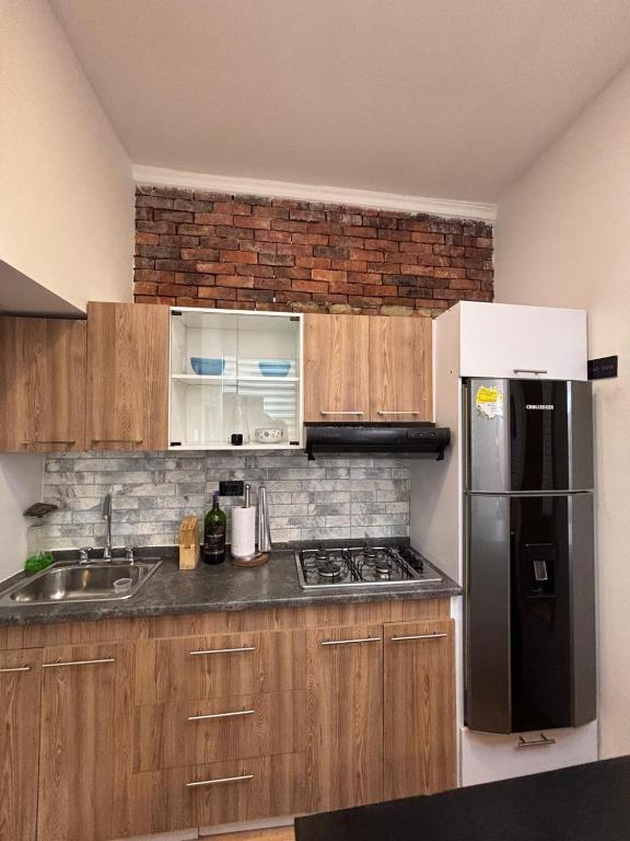 Kuchyň nebo kuchyňský kout v ubytování Hermoso Apartaestudio Todo Incluido Zona Céntrica