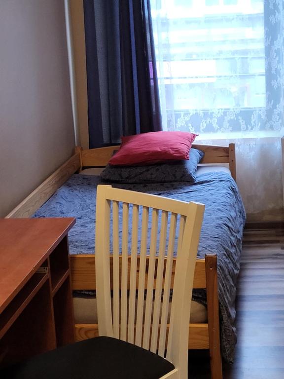 Postel nebo postele na pokoji v ubytování Hostel Gliwice Centrum PARKING