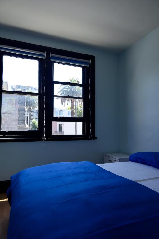 Postel nebo postele na pokoji v ubytování Ritz For Backpackers