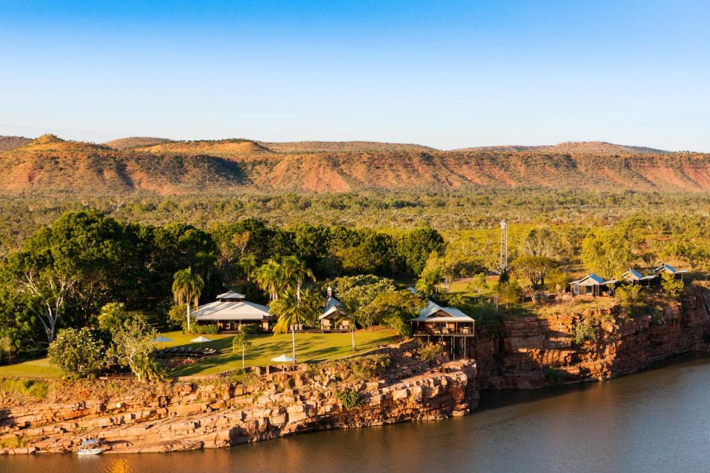 an aerial view of a resort on the banks of a river at El Questro - The Homestead in Kununurra