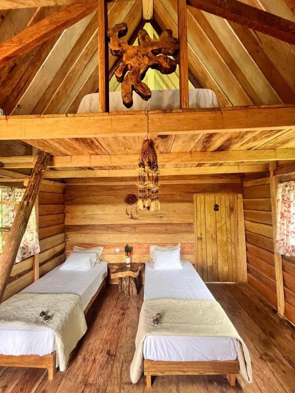 Postel nebo postele na pokoji v ubytování PuraChata Ecolodge