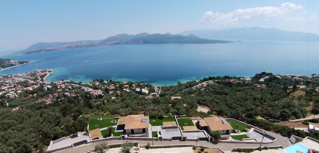 an aerial view of a town and a body of water at Pearl Mansions in Nikiana